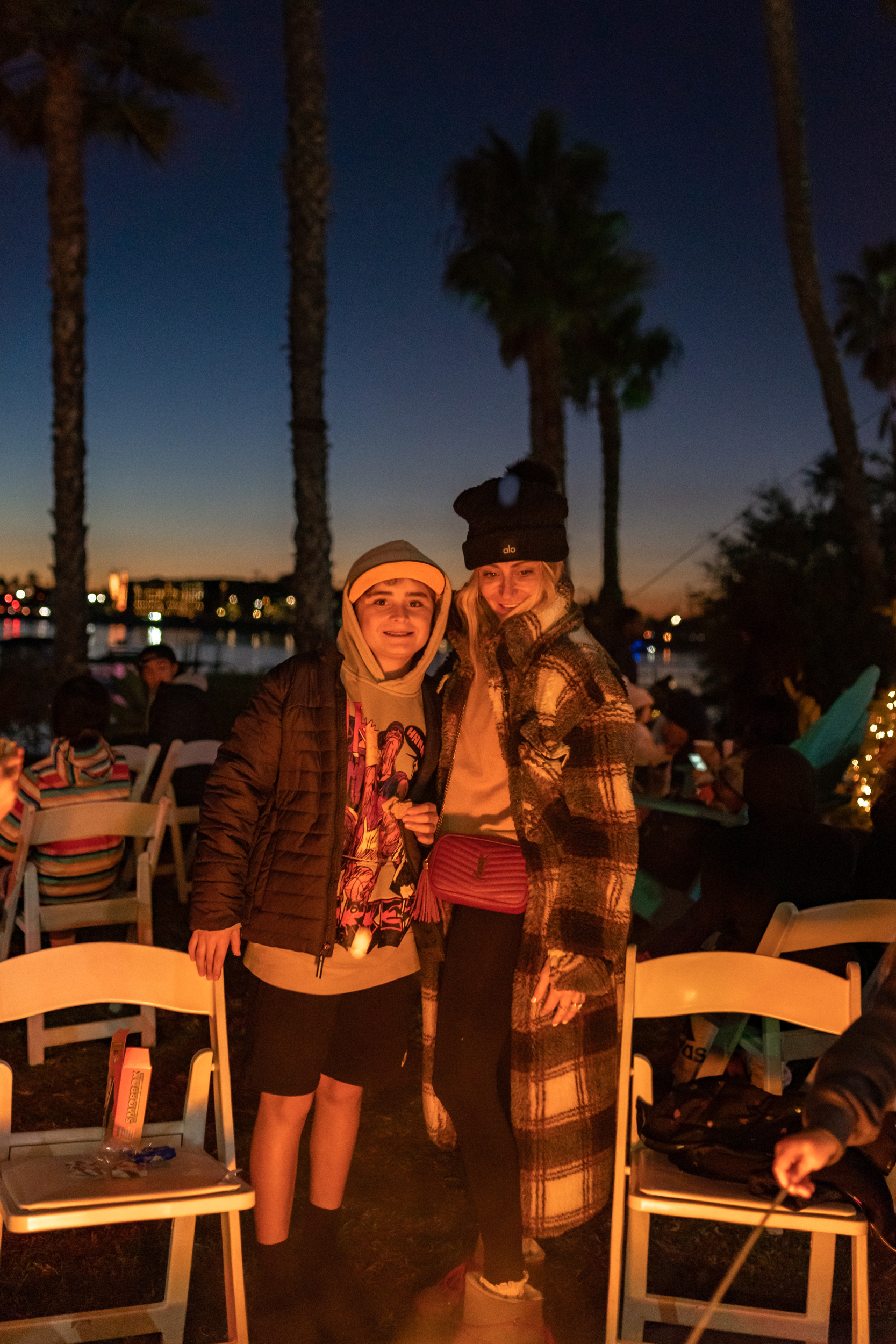 mom with her son around firepit