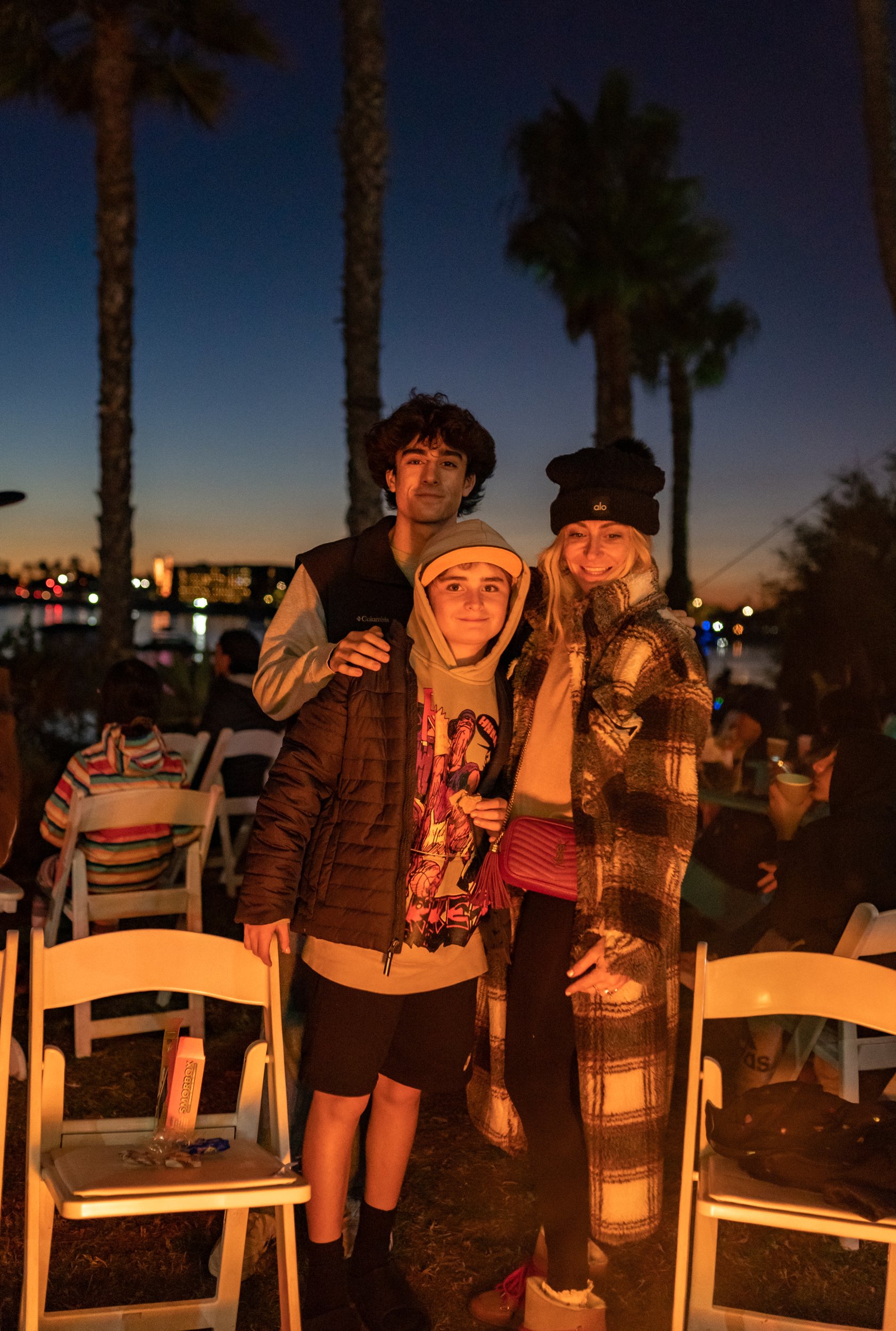 mom and kids around bonfire