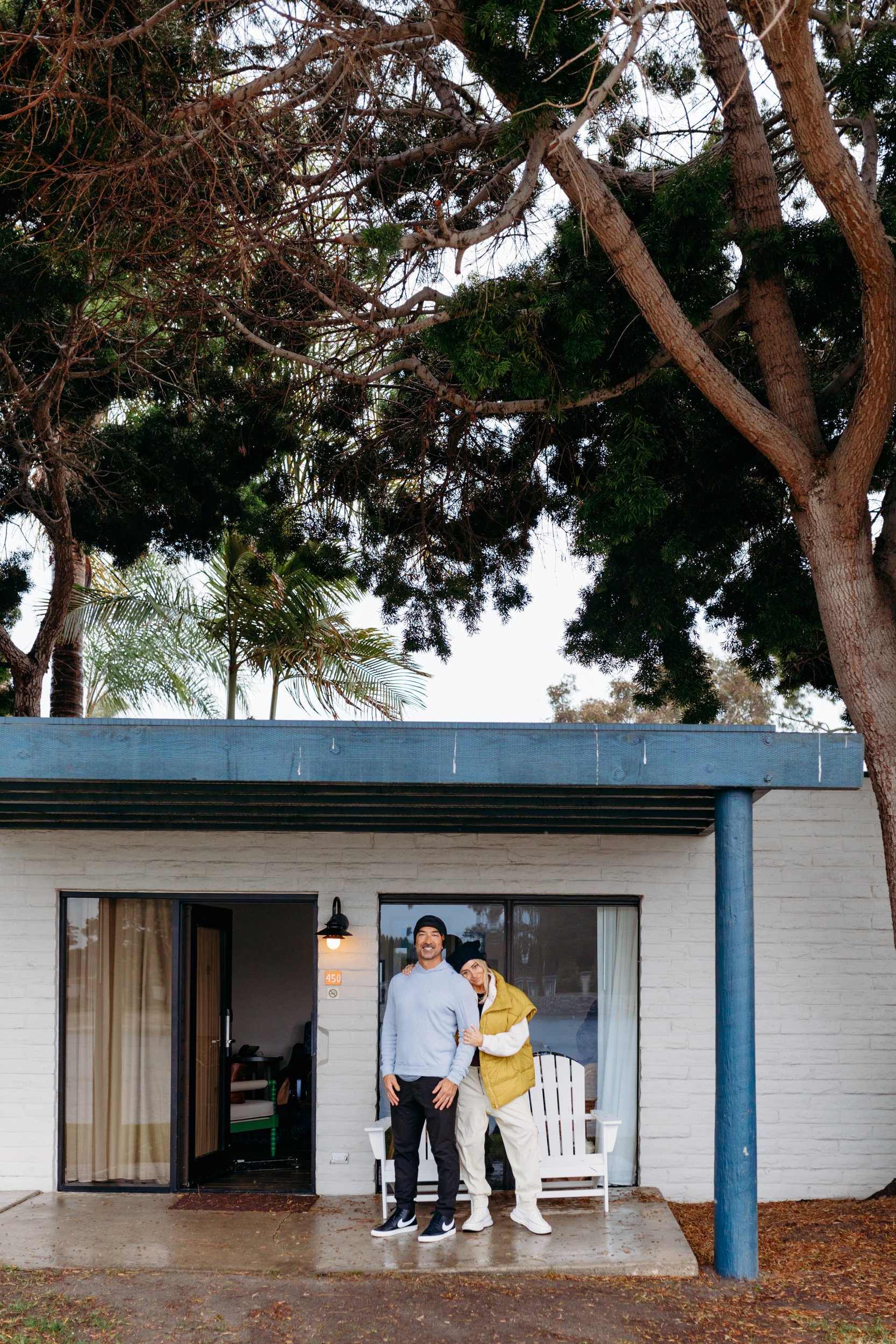 couple standing outside bungalow