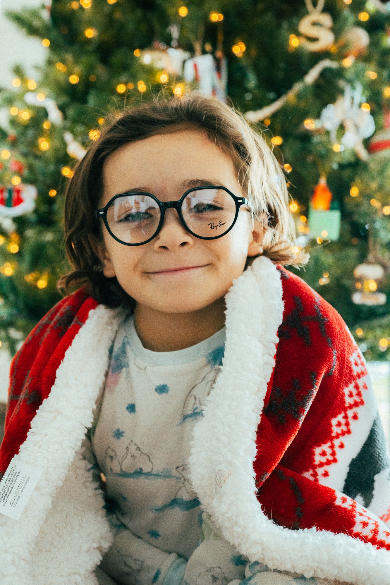 smiling boy in glasses