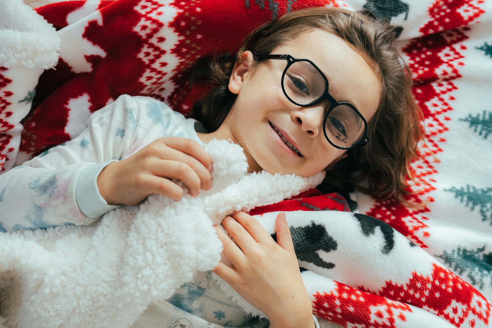 boy laying on a blanket