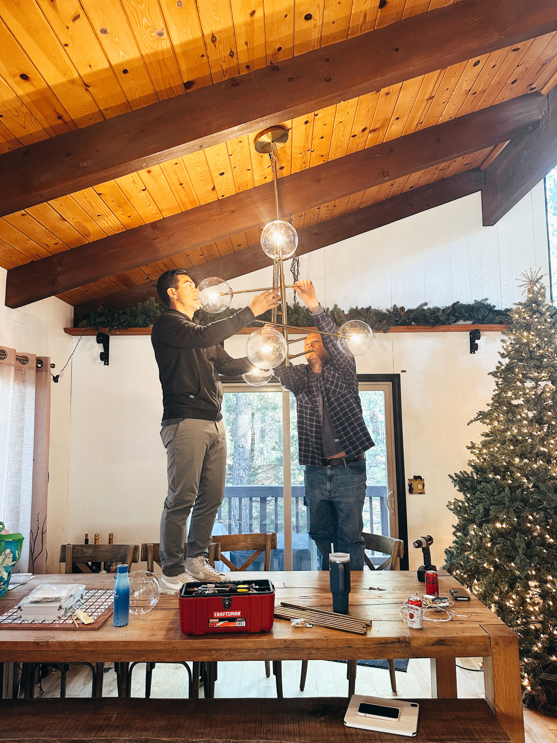 men installing a light