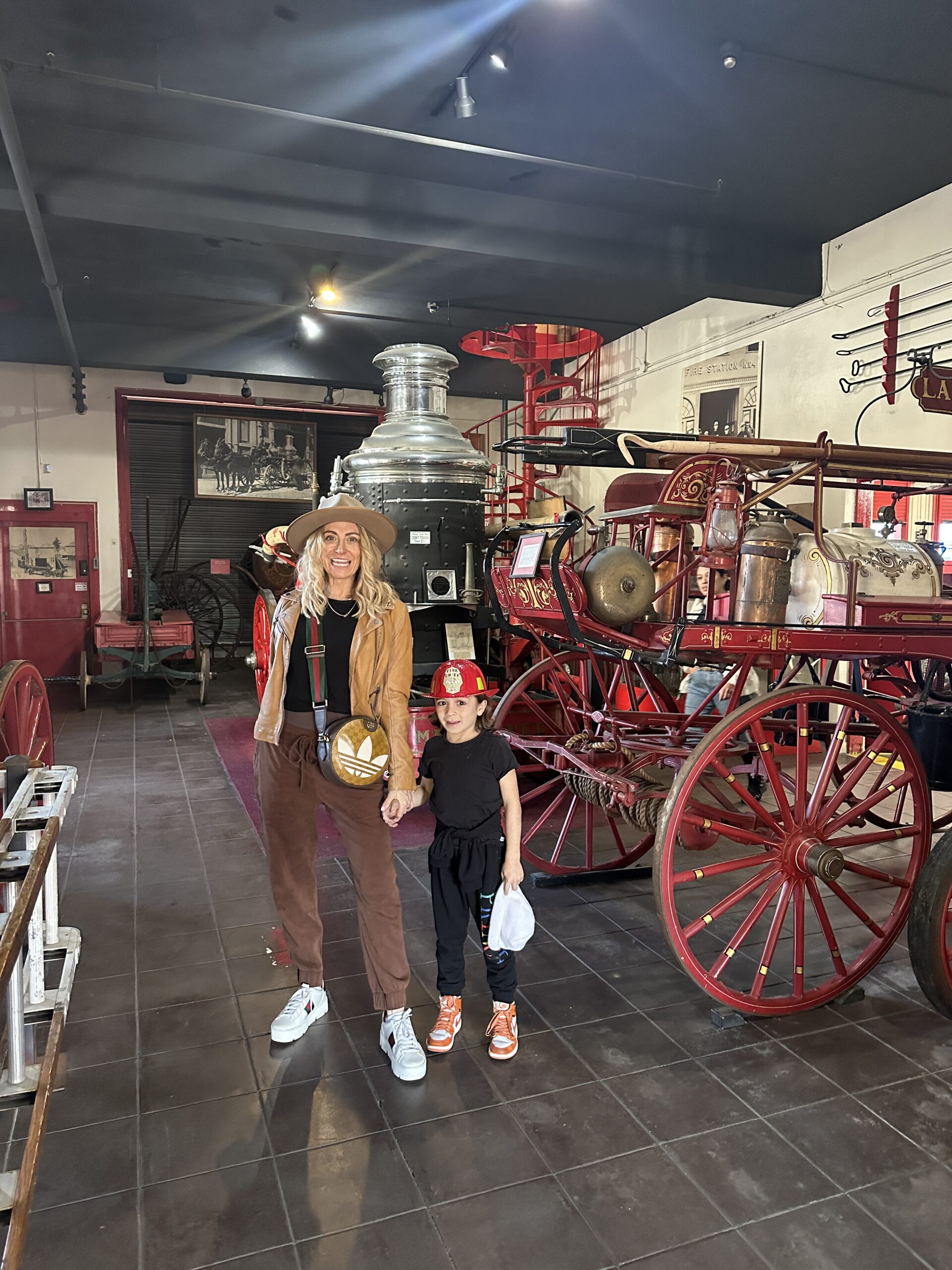 mom and son in fire station museum