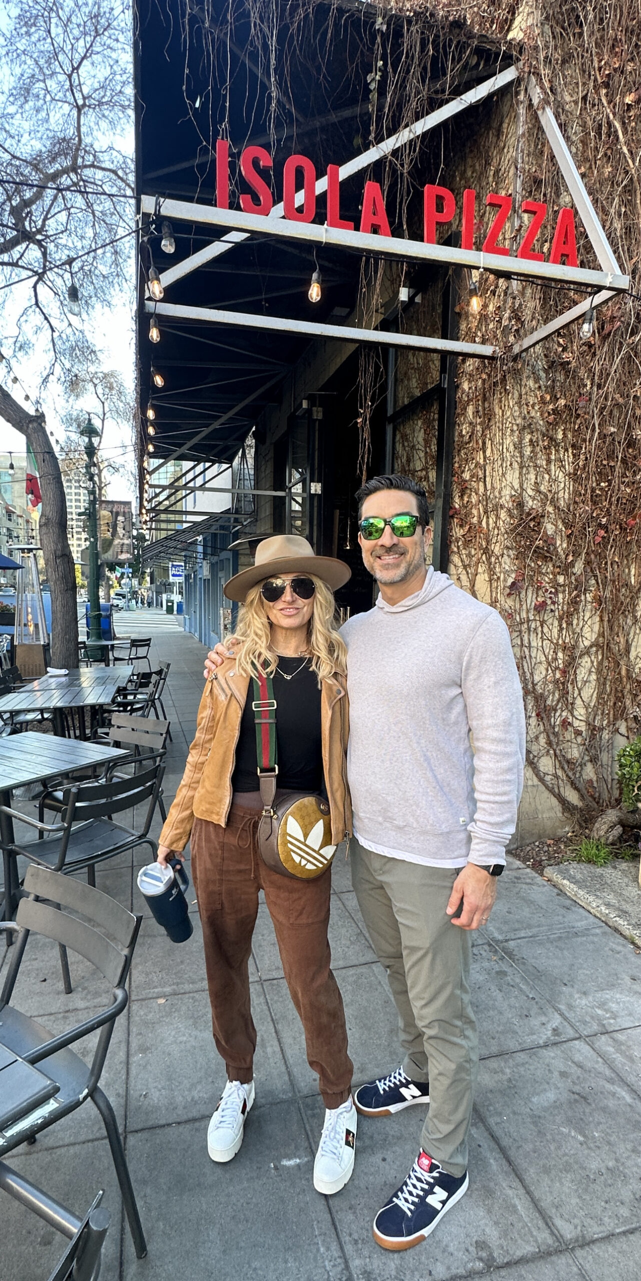 couple in front of Little Italy. San Diego restaurant, Isola Pizza