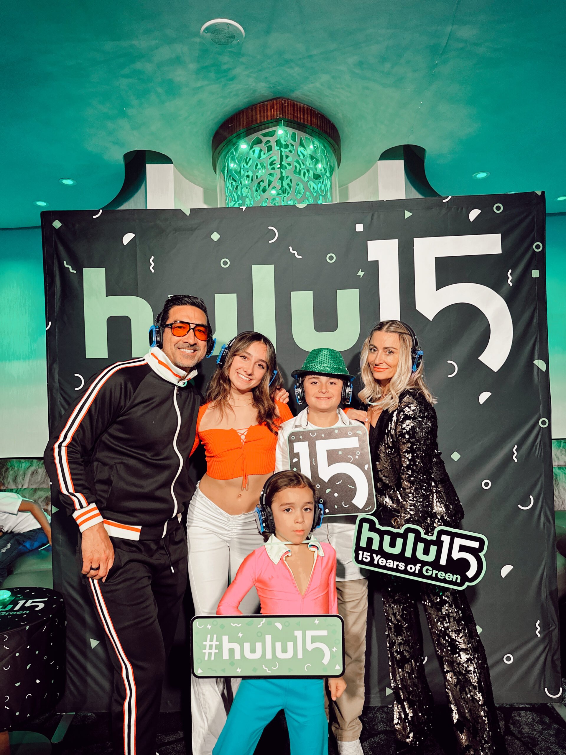A family at the Hulu party on the disney cruise line.