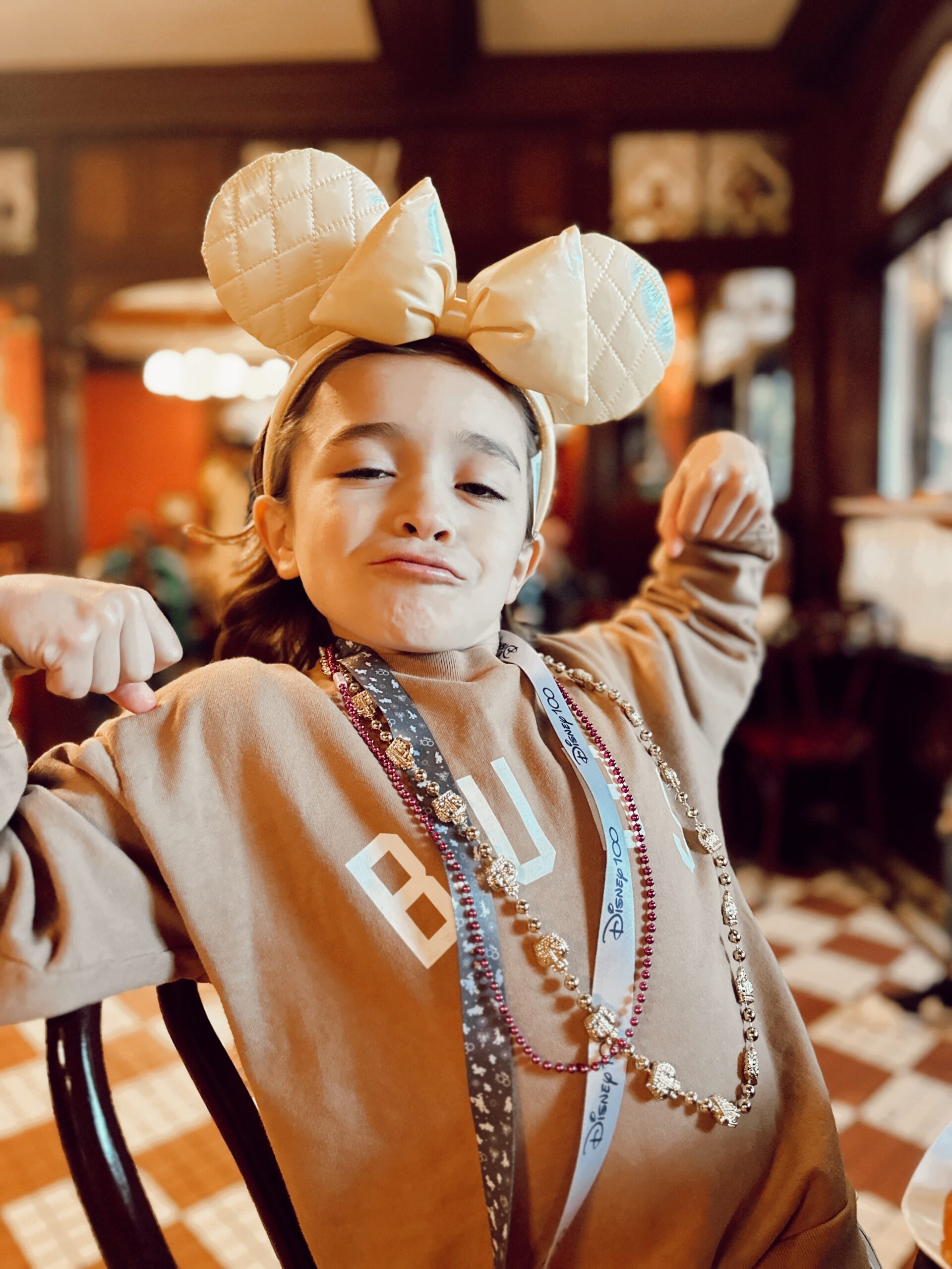 boy flexing at disneyland