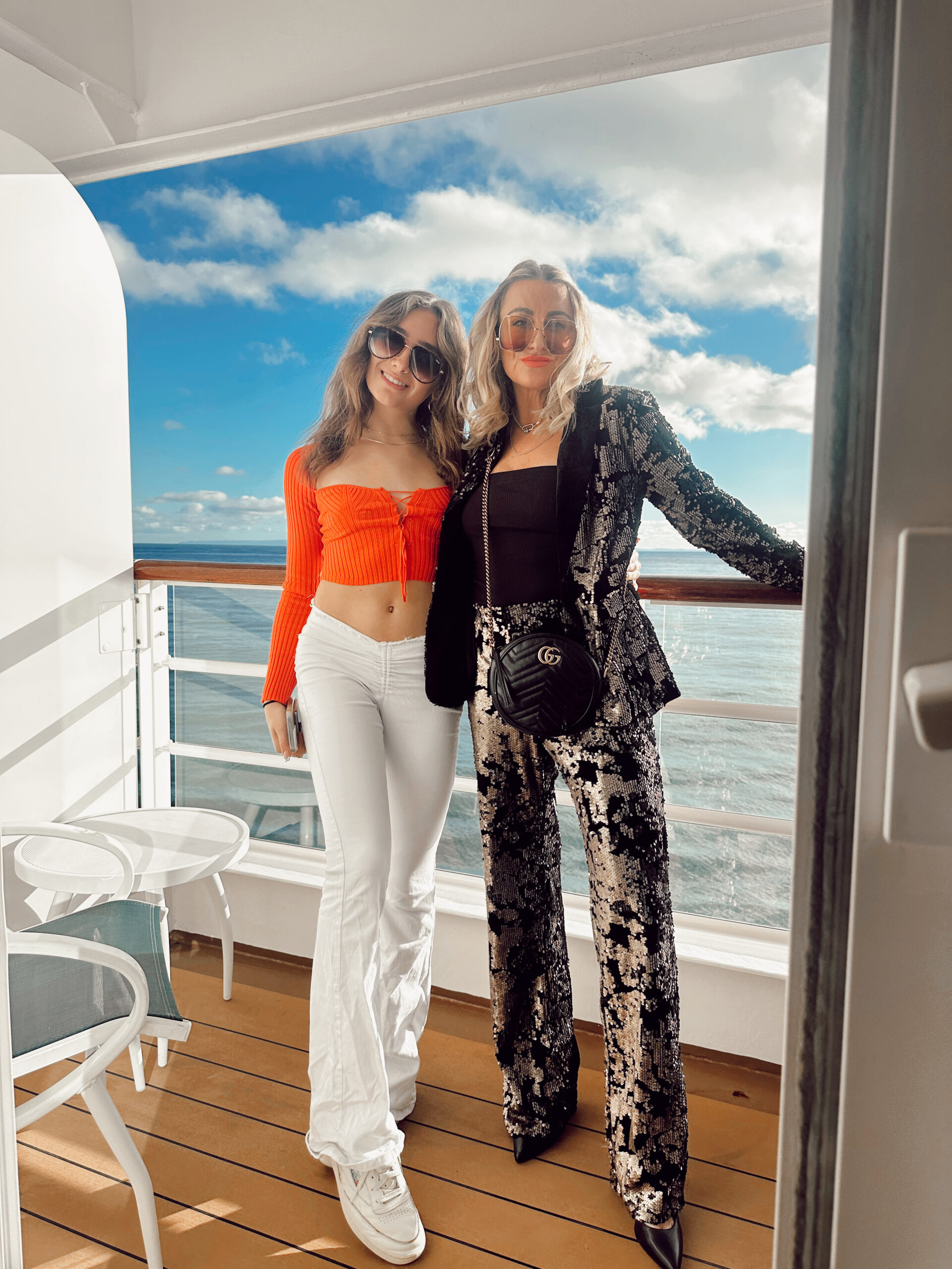 mom and daughter on cruise ship balcony
