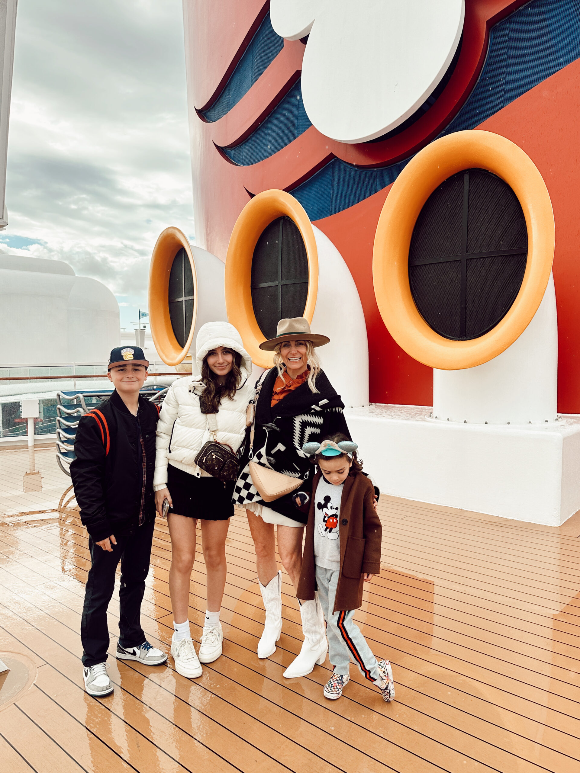 mom with kids on disney cruise deck