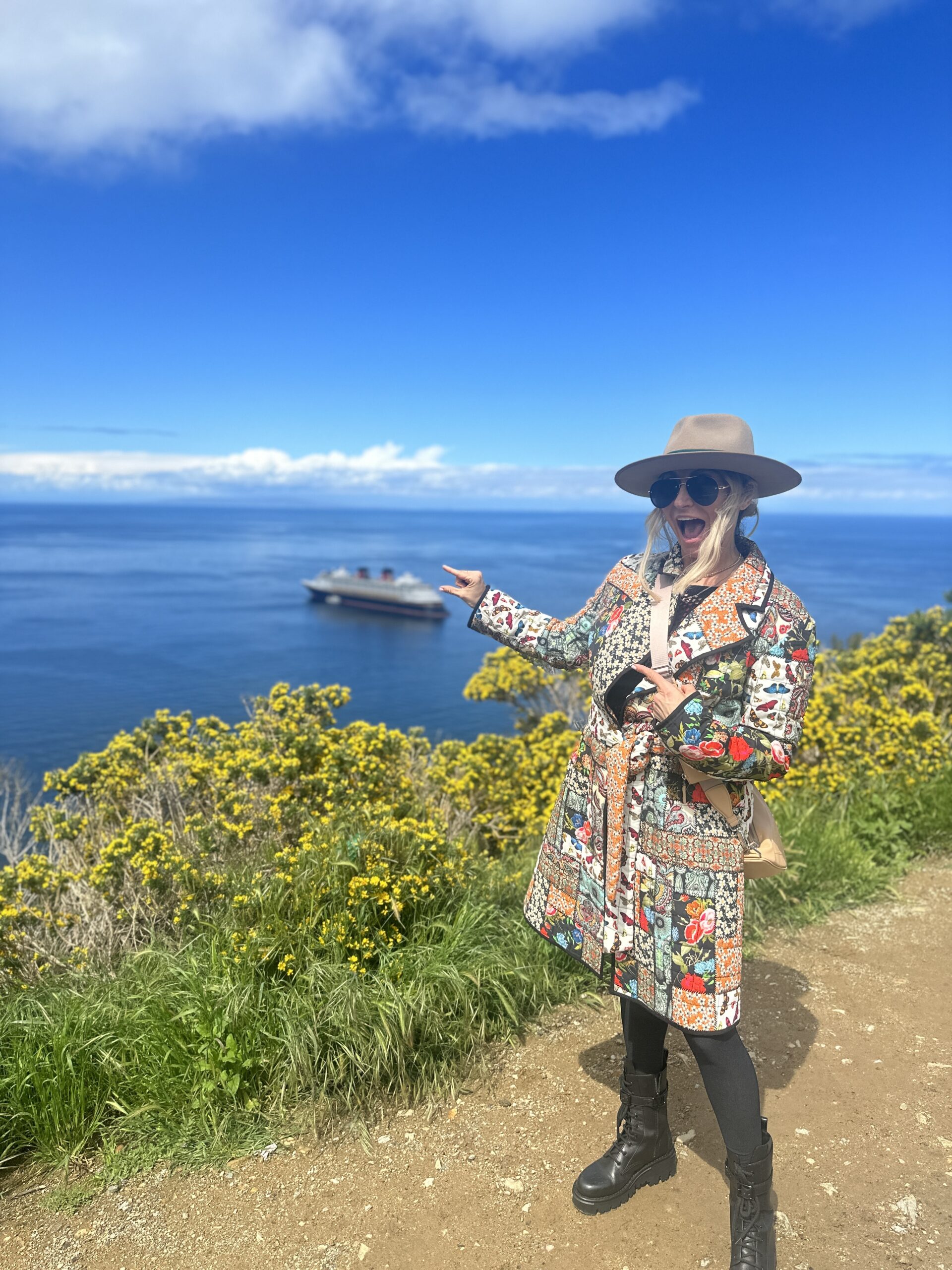 woman pointing at cruise ship