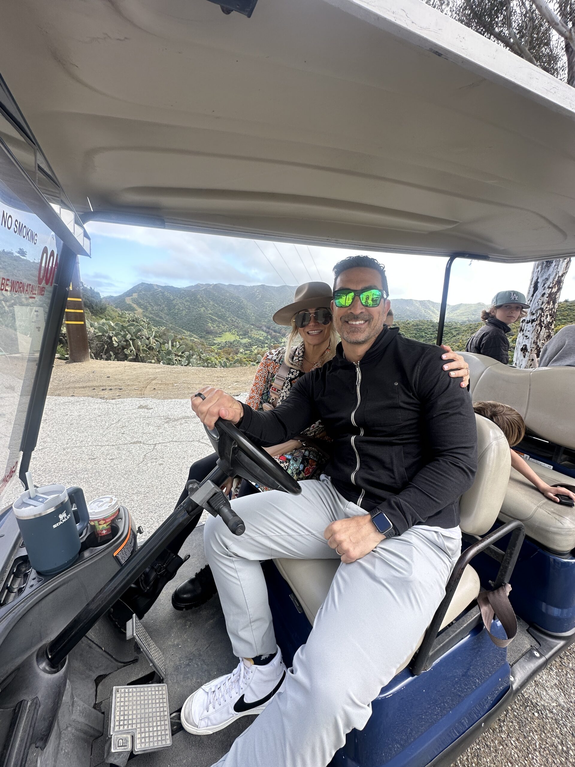 couple in golf cart