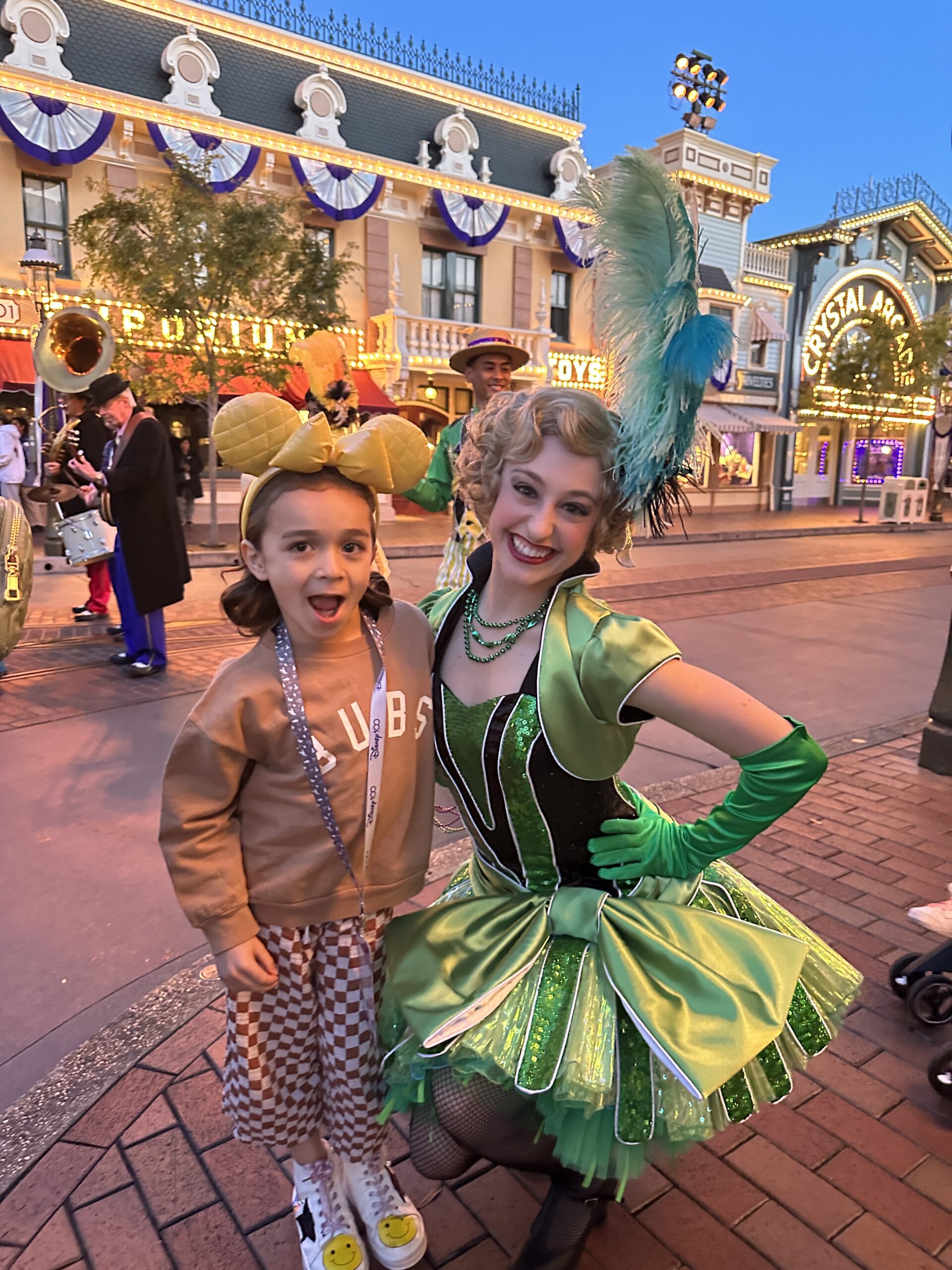 boy with disney characters on main street