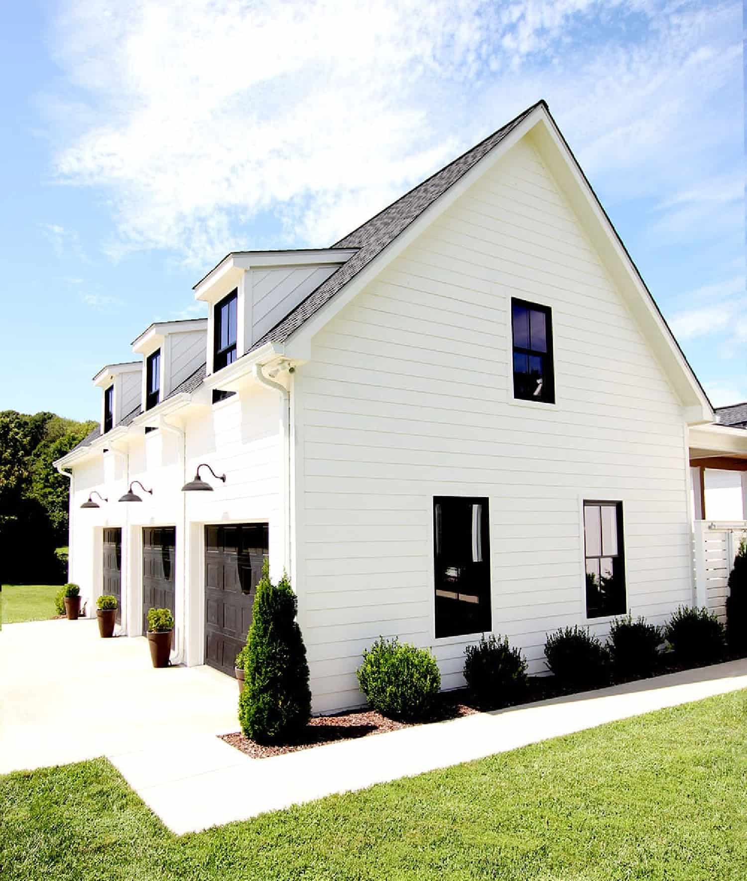 Large white house with a 3-car garage.