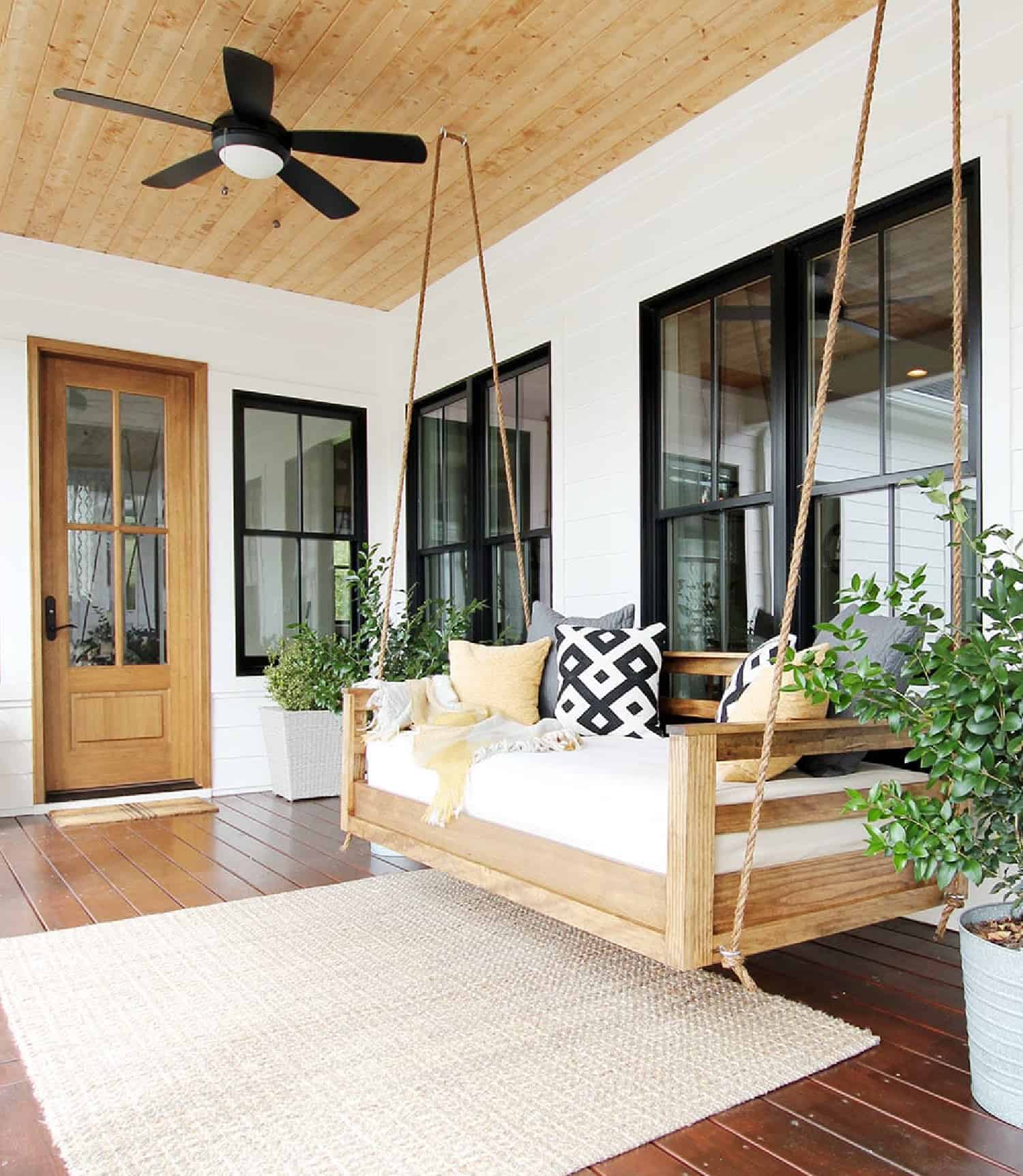 https://citygirlgonemom.com/wp-content/uploads/2023/07/modern-farmhouse-porch-swing.jpg