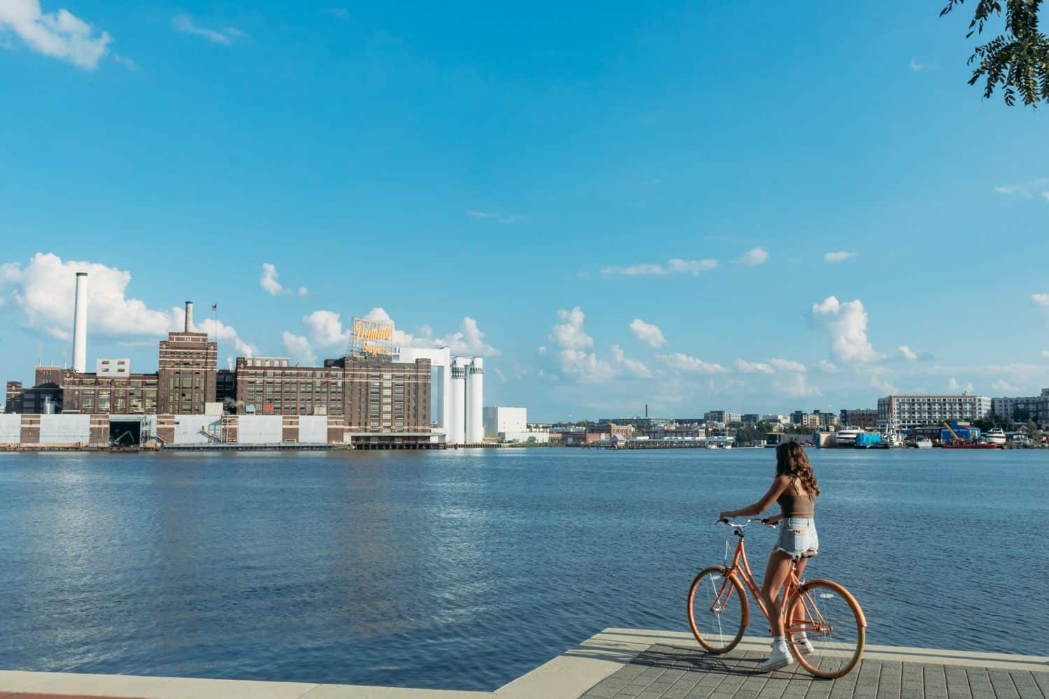 girl on a bike by the harbor