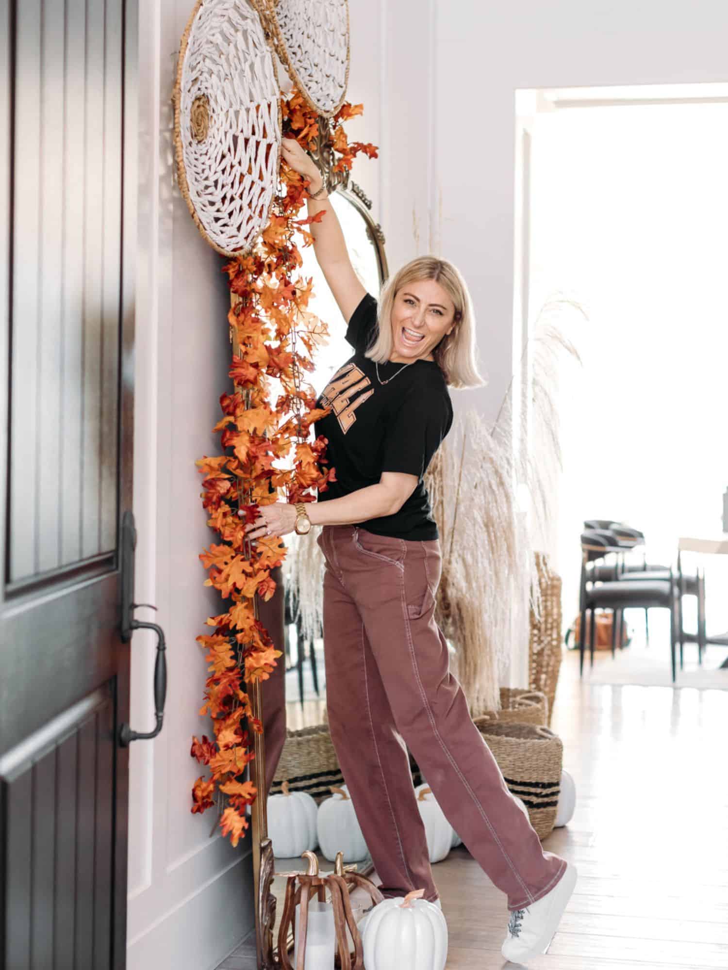 woman hanging a basket on the wall