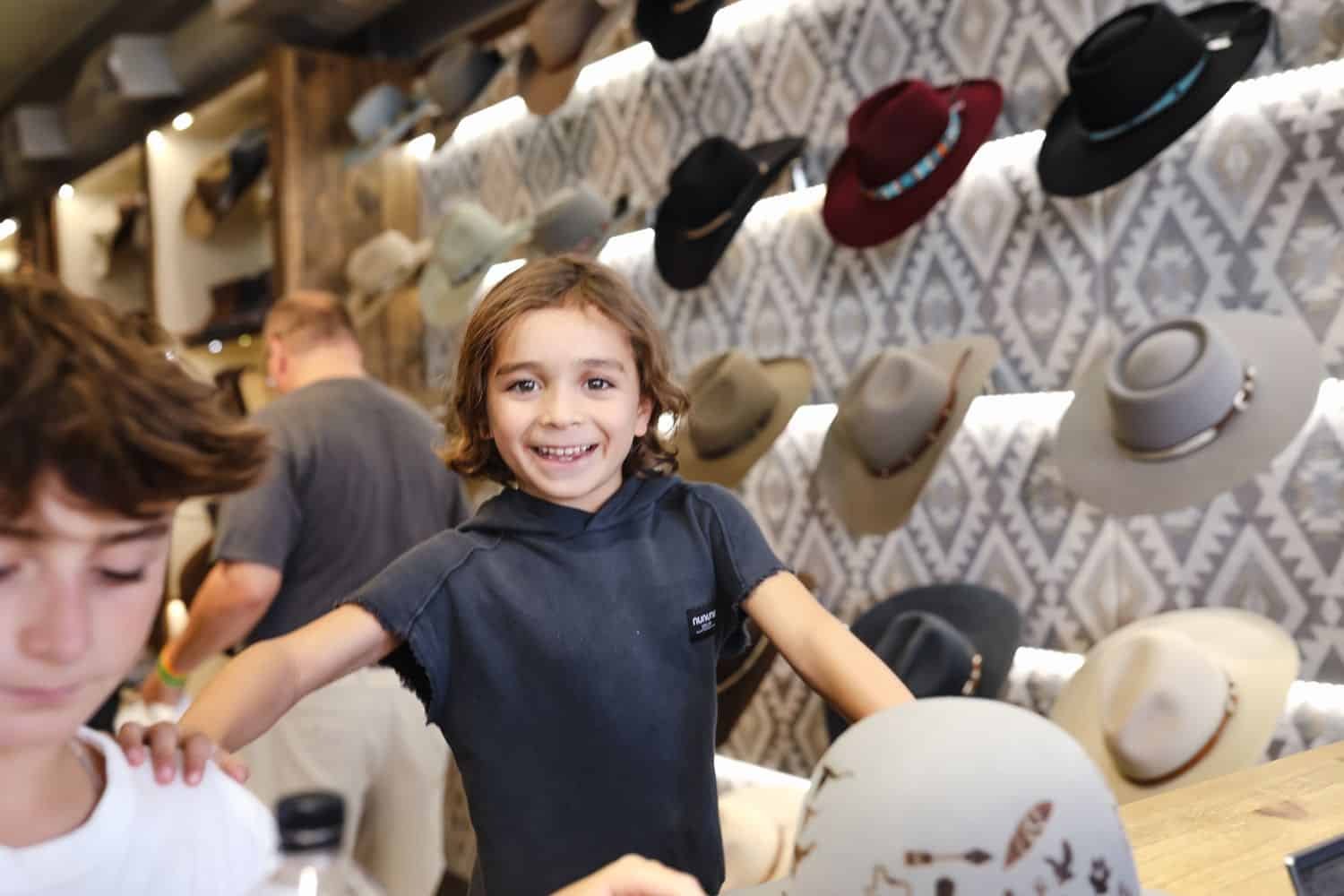 Boy in a hat store