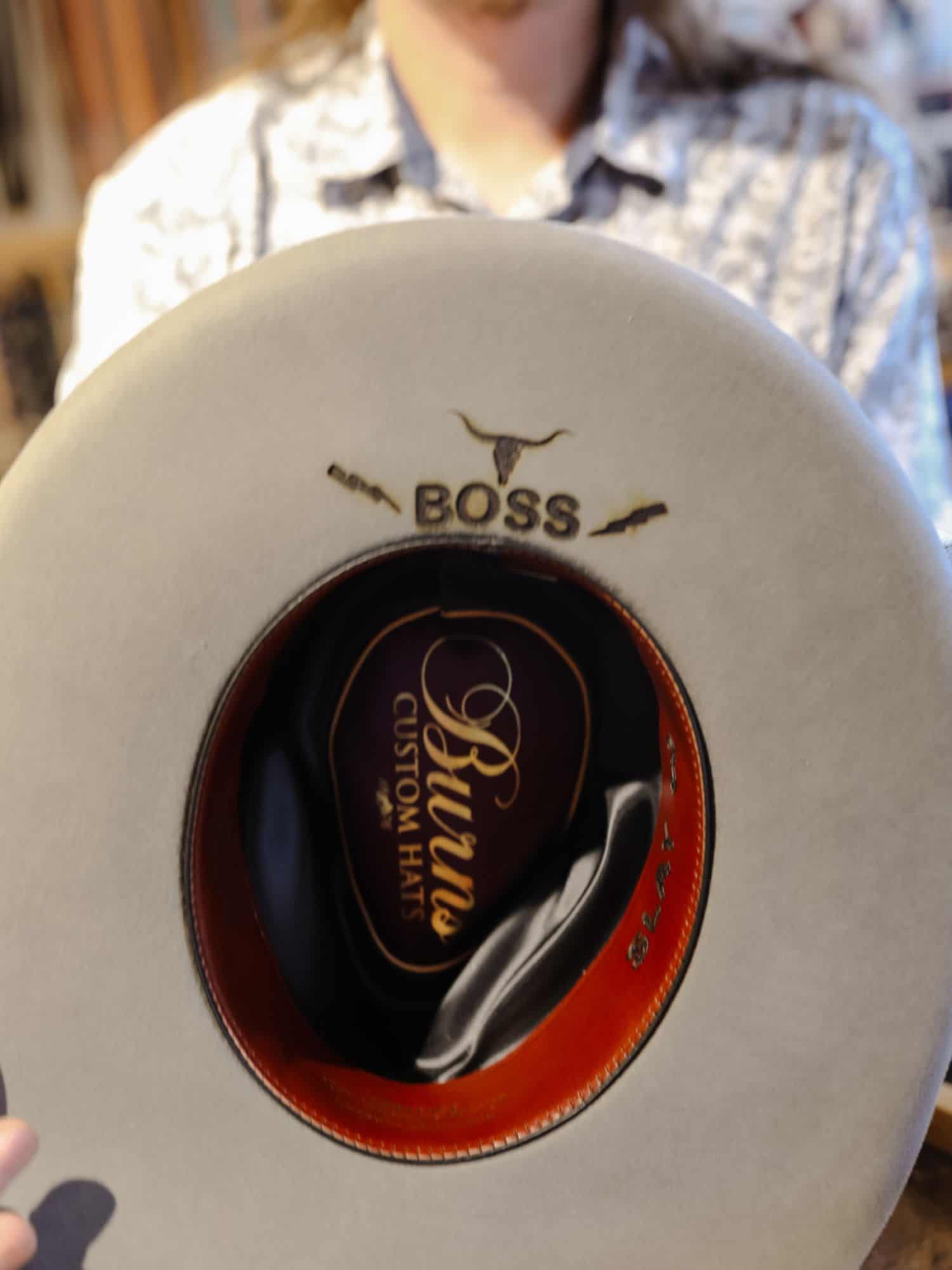 boss written on hat