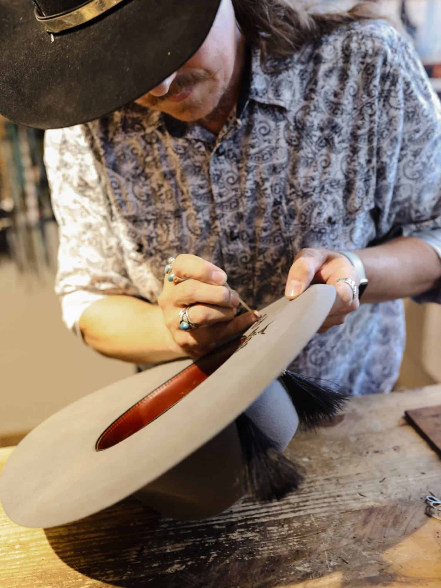 man embossing hat