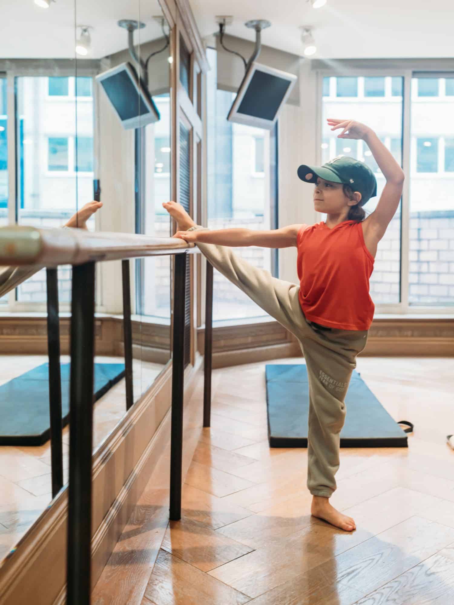 Boy doing a barre workout