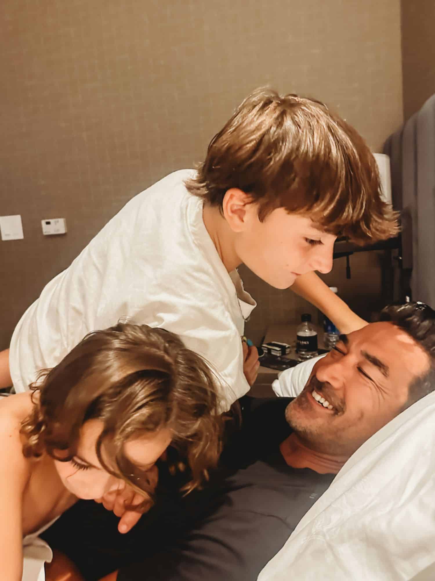 kids in bed with dad