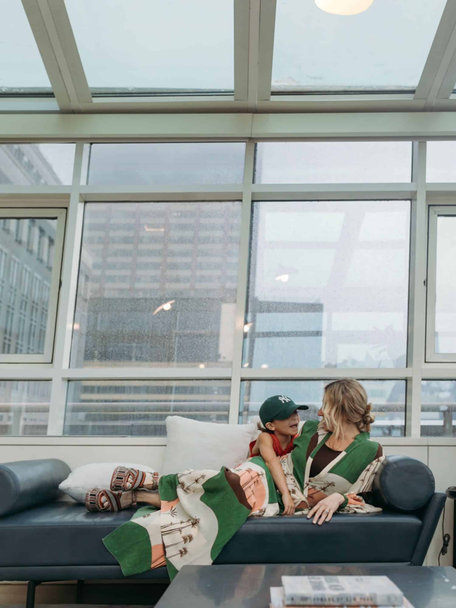 boy and mom sitting on the couch