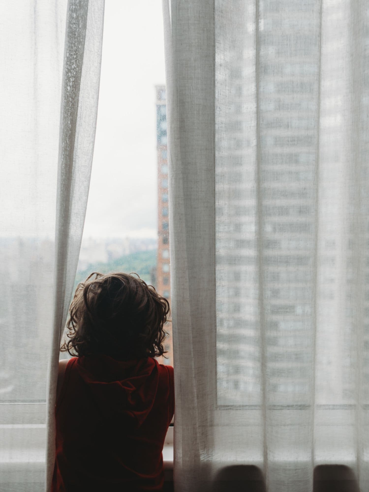 boy looking out the window