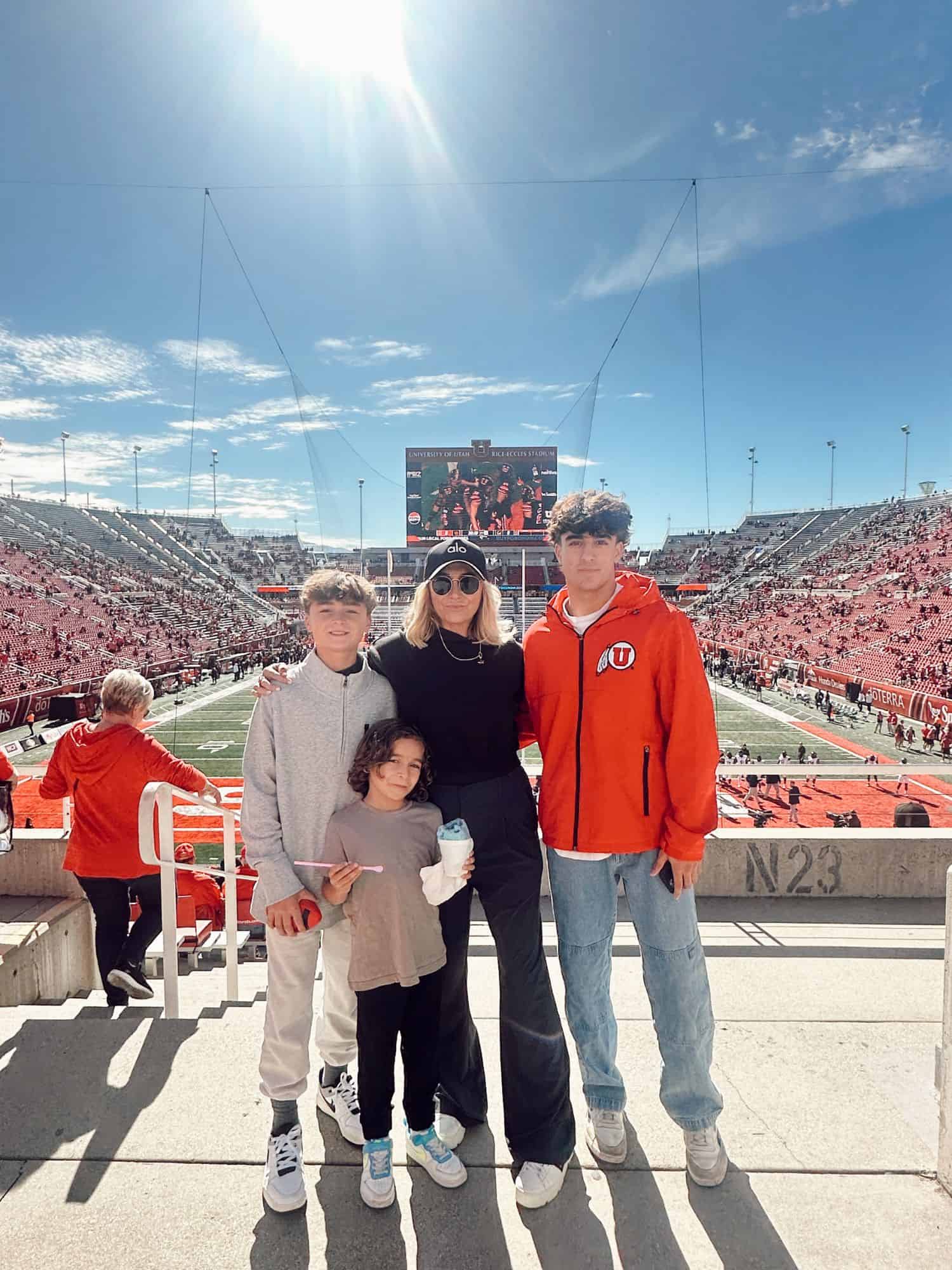 family standing at stadium