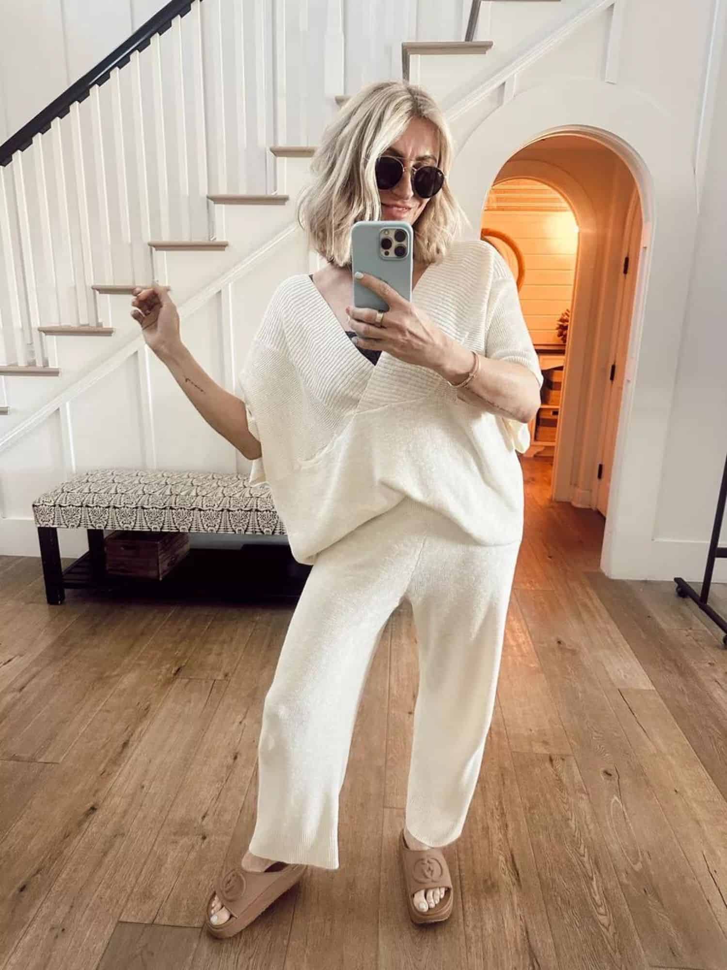 lady in cream outfit in sunglasses