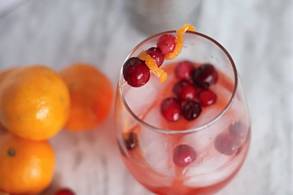 clementine and cranberry cocktail in a clear glass