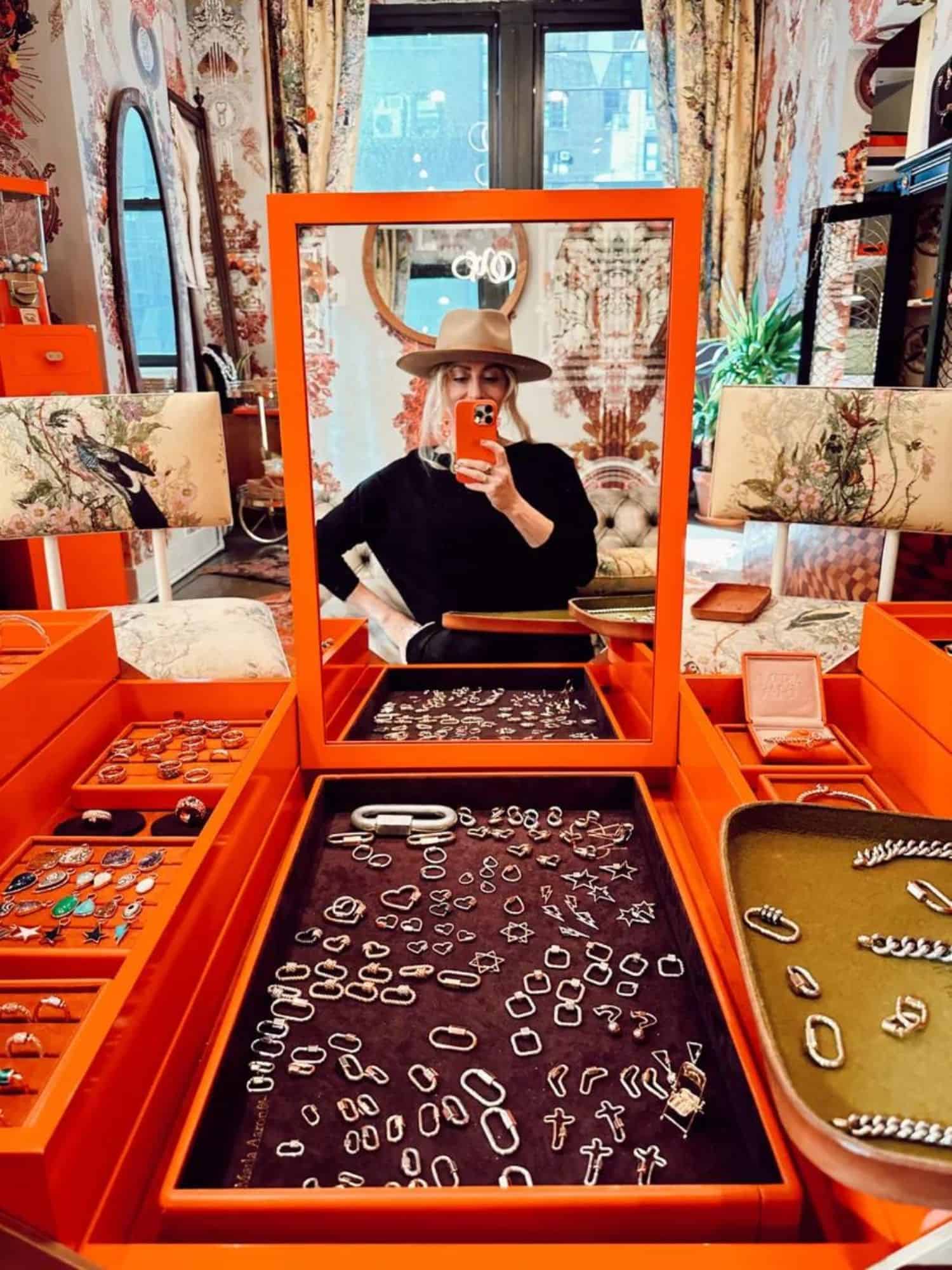 woman in front of jewelry case